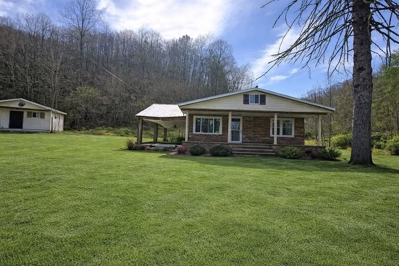 Affordable 6.9-Acre Brick Fixer-Upper with Creek Frontage & Seller Financing Opportunity