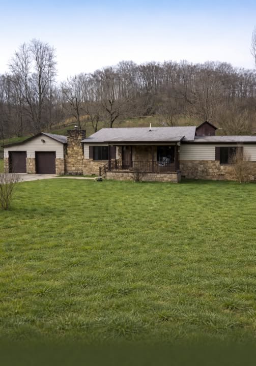Charming Ranch-Style Home with Stone Accents and Peaceful Outdoor Space